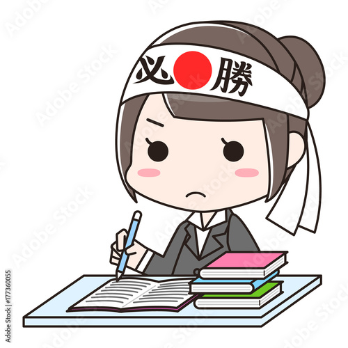 鉢巻きをして資格や入社試験などの勉強をする女性