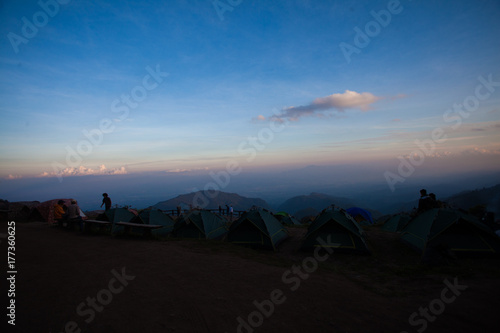 Camping tent in the top of mountain in the sunrise with Mist