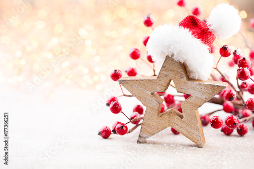 Christmas background. Christmas star and santa hat. Greeting card. © gitusik