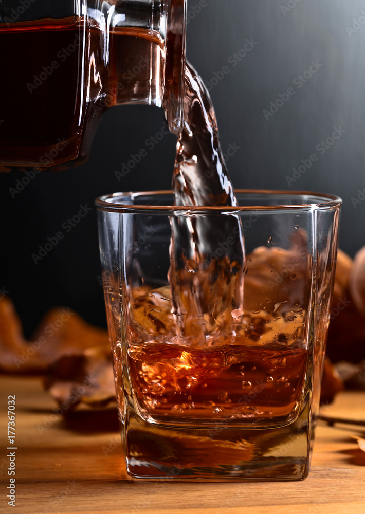 Whiskey on a old wooden table. Whiskey on a old wooden table.