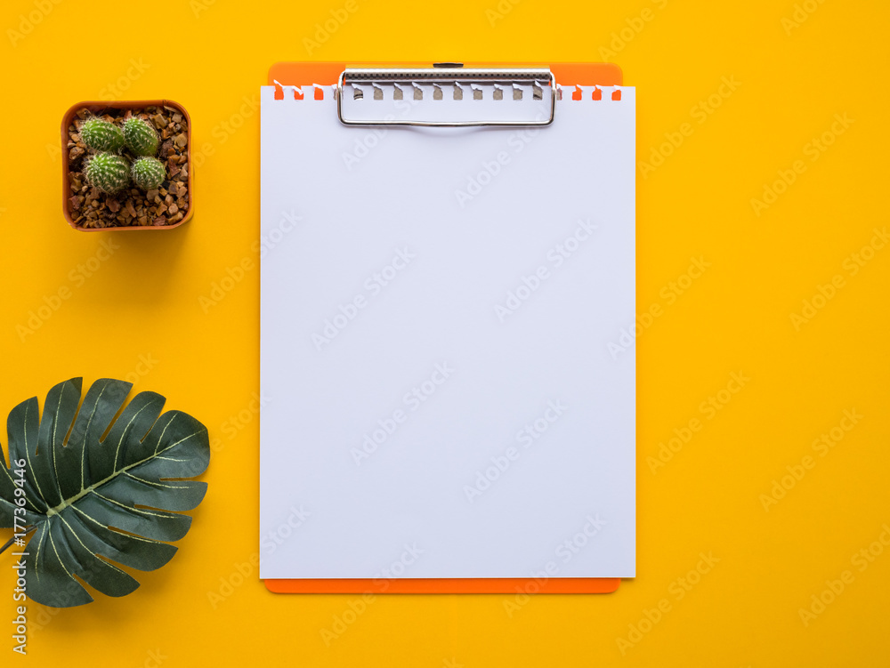 Design flat lay image of workspace desk with office supplies on yellow background. Design flat lay image of workspace desk with office supplies on yellow background.