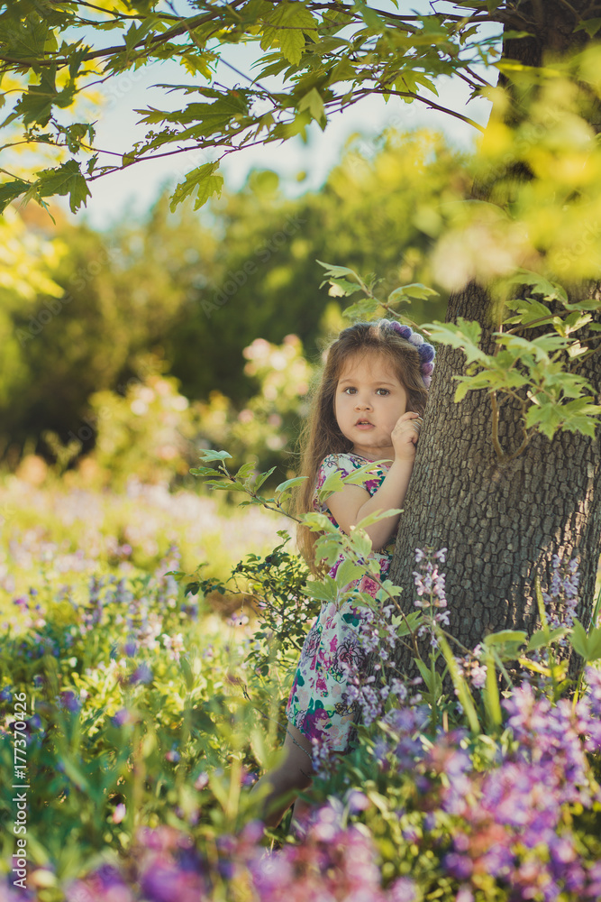 colourful summer scene of cute runette young girl child enjoying free time in wild forest flowers field wearing stylish tiny dress on sunny meadow colourful summer scene of cute runette young girl child enjoying free time in wild forest flowers field wearing stylish tiny dress on sunny meadow