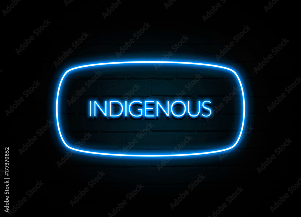 Indigenous - colorful Neon Sign on brickwall Indigenous - colorful Neon Sign on brickwall