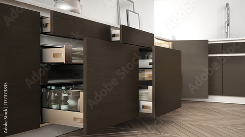 Modern kitchen, opened wooden drawers with accessories inside, solution for kitchen storage, minimalist interior design