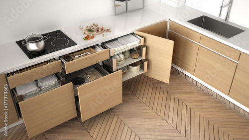 Modern kitchen top view, opened wooden drawers with accessories inside, solution for kitchen storage, minimalist interior design