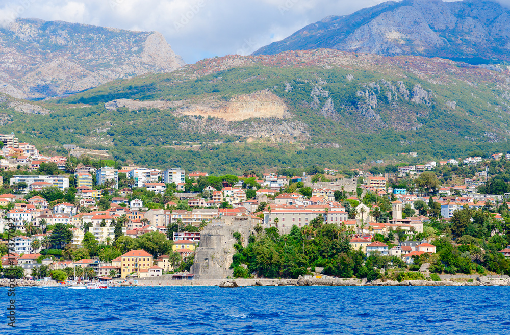 Fototapeta premium View of resort town of Herceg Novi and fortress of Forte Mare from sea, Montenegro