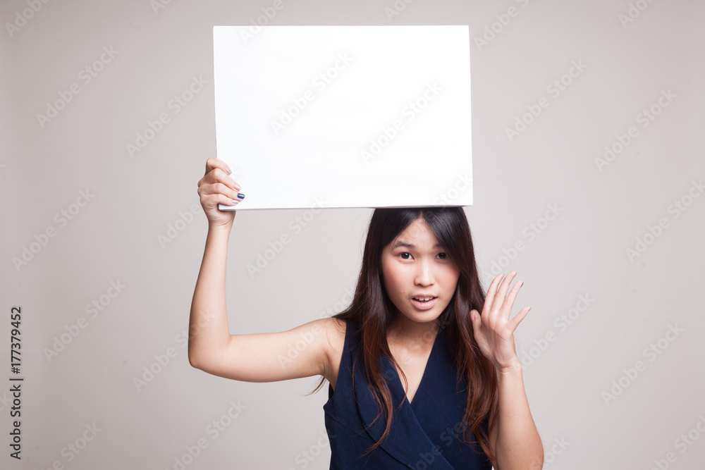 Young Asian woman surprise with white blank sign. Young Asian woman surprise with white blank sign.