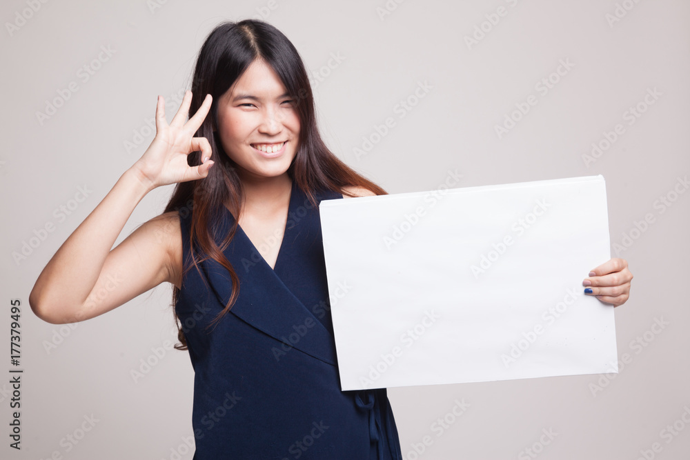 Young Asian woman show OK with white blank sign. Young Asian woman show OK with white blank sign.