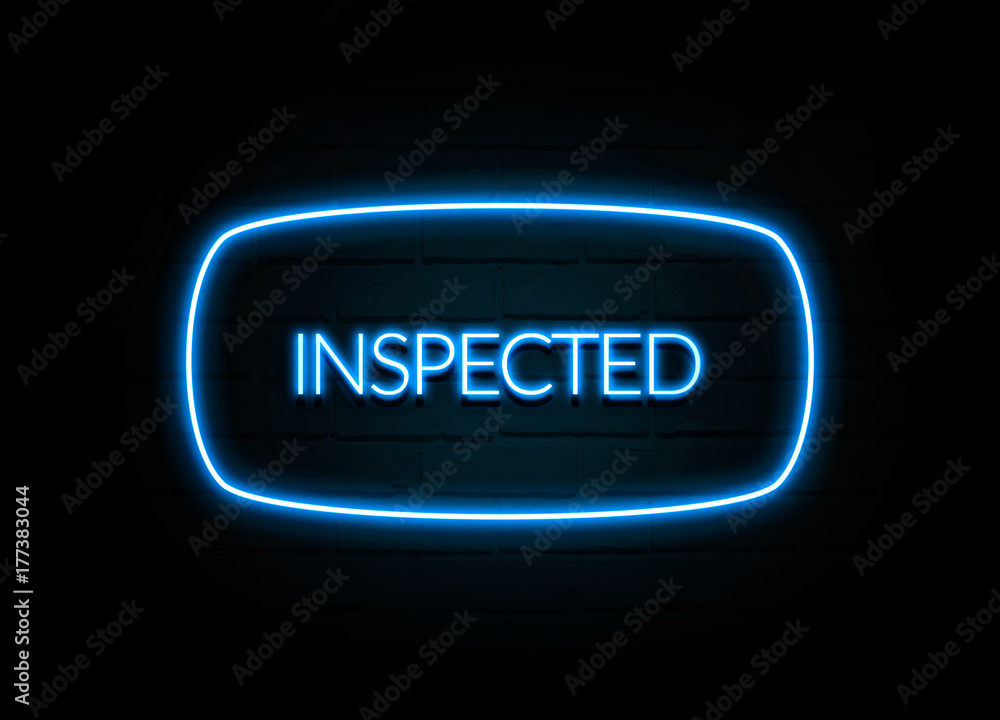 Inspected - colorful Neon Sign on brickwall Inspected - colorful Neon Sign on brickwall