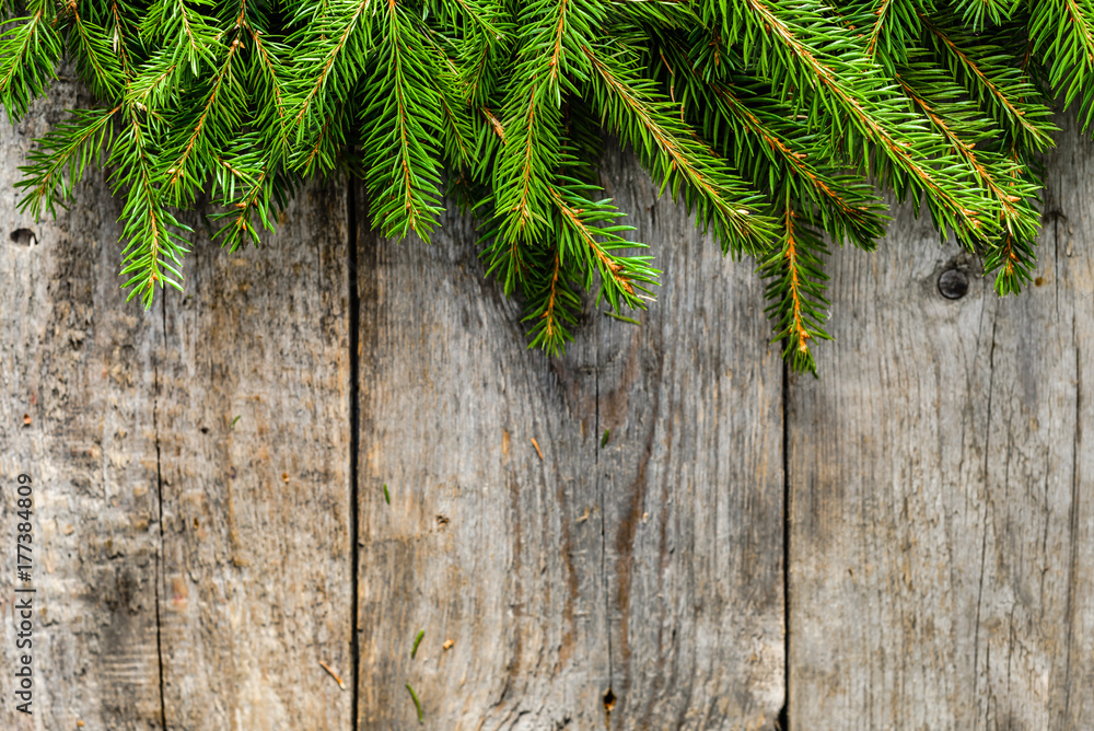 Wooden background with green fir frame, christmas decoration Wooden background with green fir frame, christmas decoration