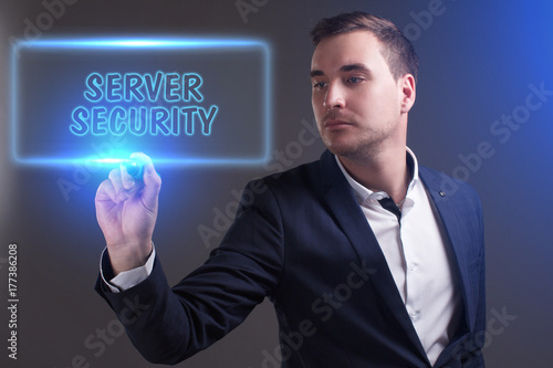 The concept of business, technology, the Internet and the network. Young businessman showing inscription: Server security