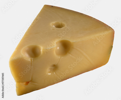 Slice of Jarlsberg cheese on white background photo