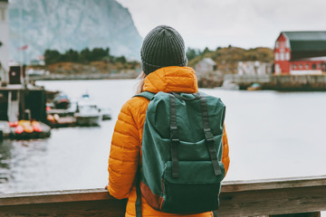 Woman traveler enjoying Norway village landscape Travel Lifestyle concept adventure winter vacations outdoor