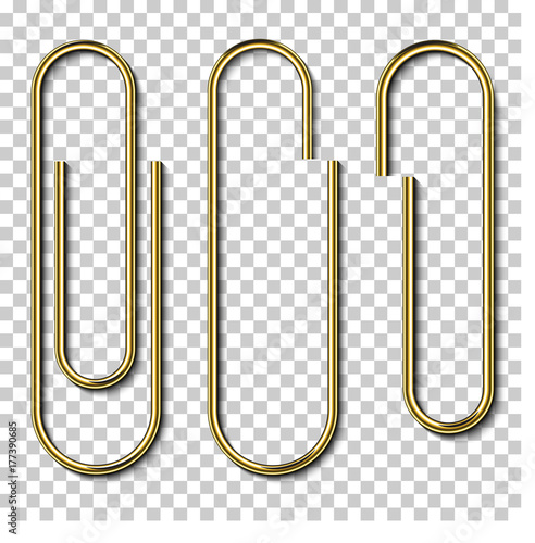 Metal gold paperclips isolated and attached to white paper isolated on transparent background photo