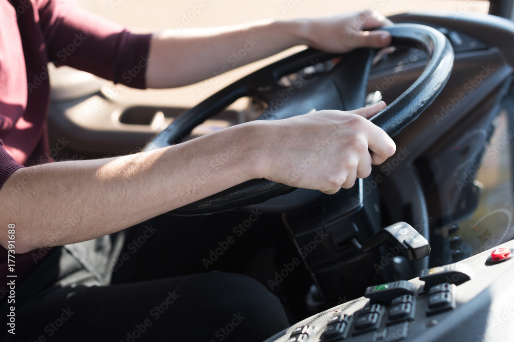 driver holding steering wheel