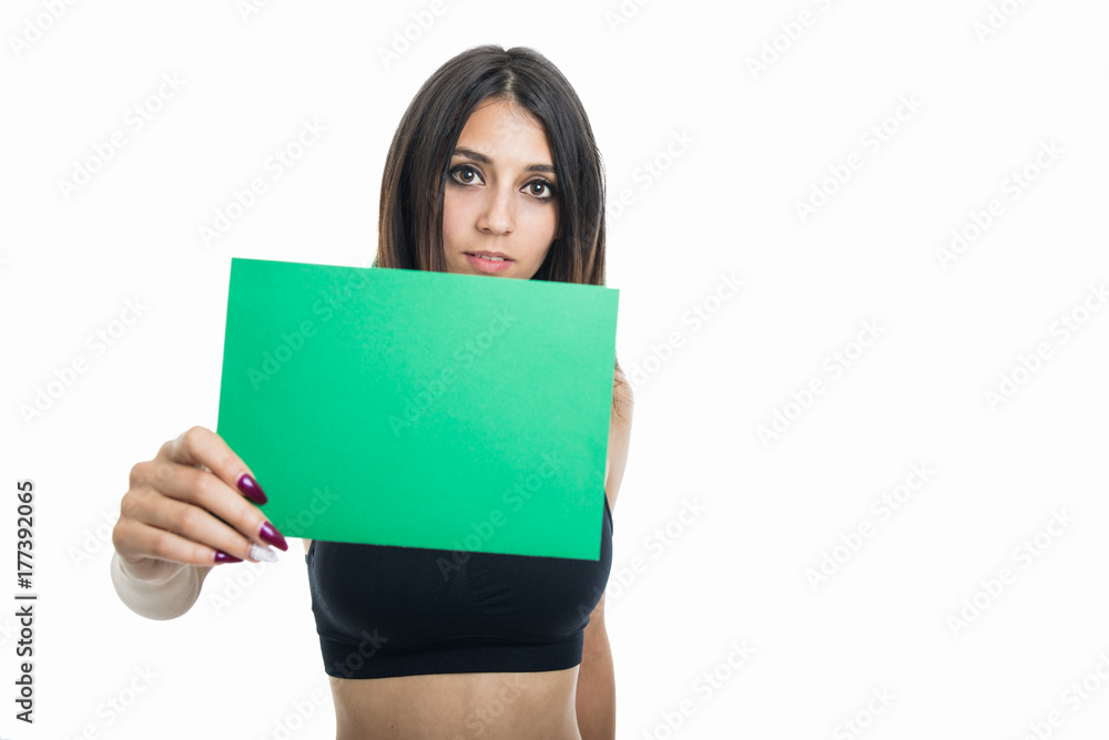Portrait of fit girl holding green cardboard Portrait of fit girl holding green cardboard