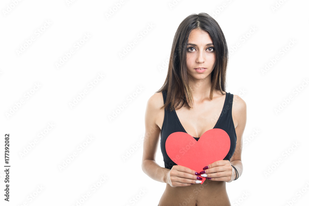 Portrait of fit girl holding red heart shape Portrait of fit girl holding red heart shape