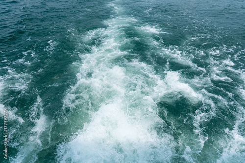 Sea wave of view behind the passenger boat.