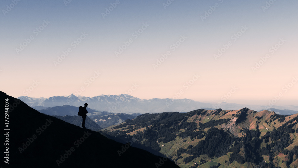 silhouette of a hiker in the alps silhouette of a hiker in the alps