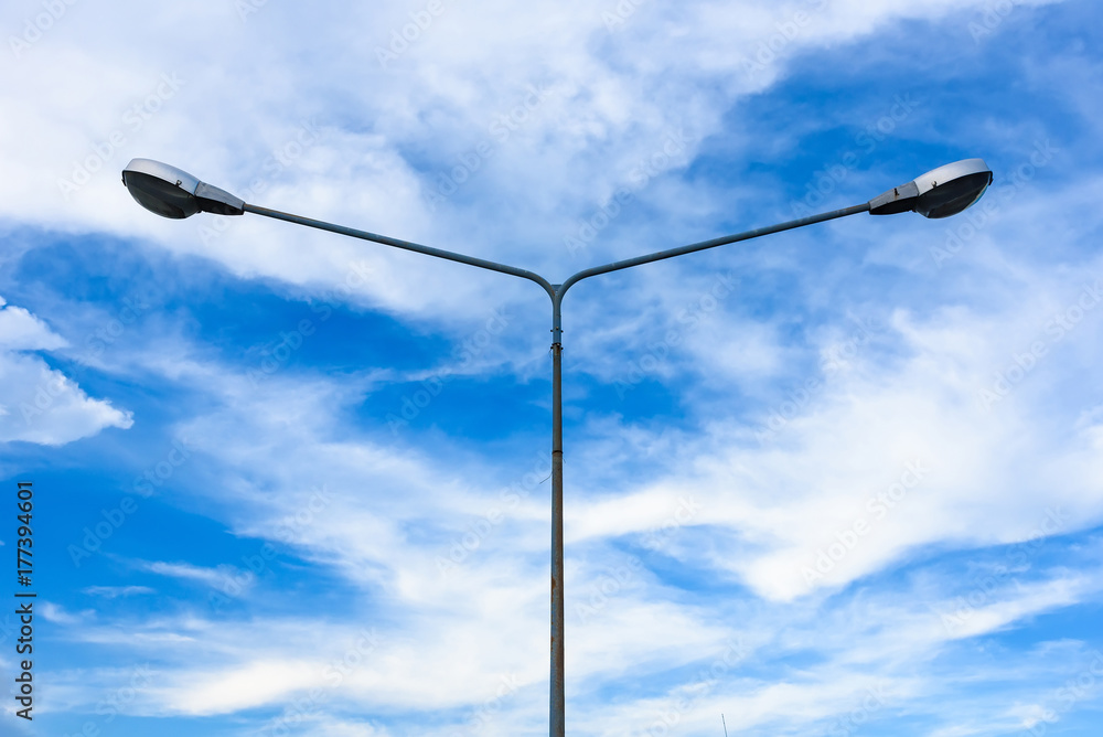 Electric street light pole on blue vivid sky in day light. Electric street light pole on blue vivid sky in day light.