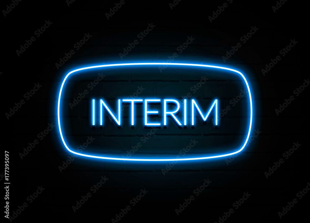 Interim - colorful Neon Sign on brickwall Interim - colorful Neon Sign on brickwall