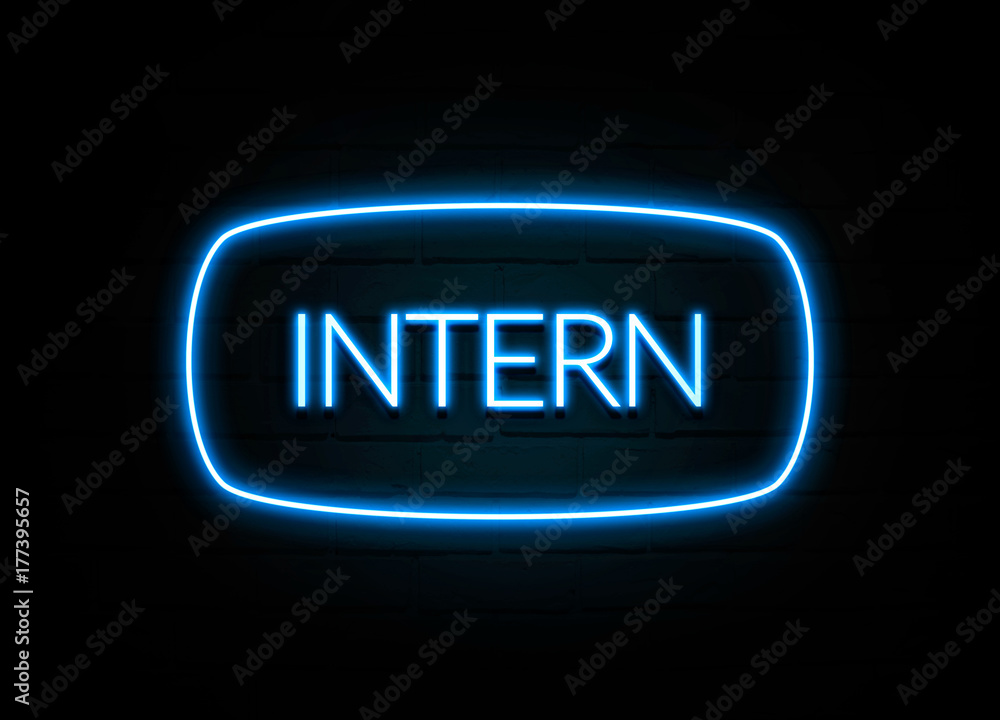 Intern - colorful Neon Sign on brickwall Intern - colorful Neon Sign on brickwall