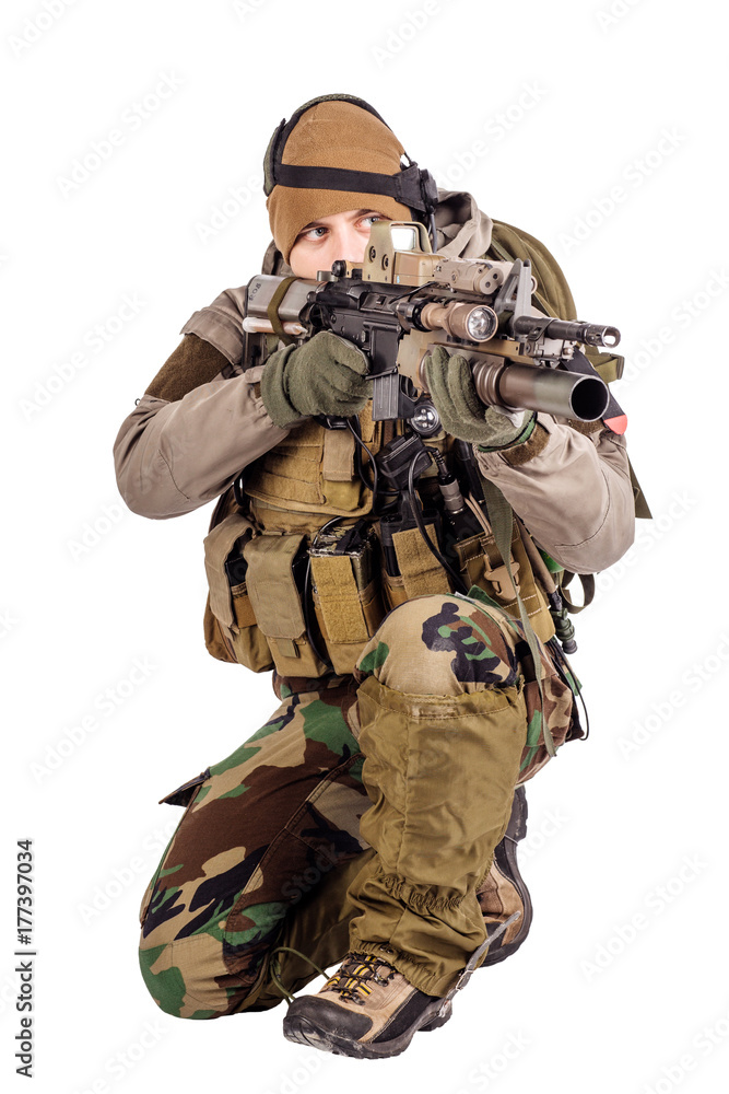 Soldier with rifle isolated on a white background. war, army, weapon and people concept. Soldier with rifle isolated on a white background. war, army, weapon and people concept.