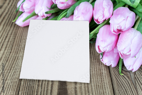 Tulip flowers and card on t...
