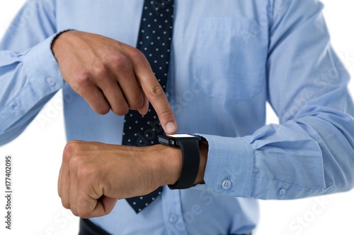 Close up of businessman using smartwatch
