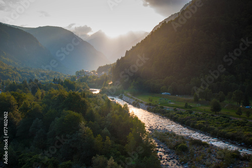Panoramic view with scenic mountain landscape at sunset. Sesia river valley in Scopello, Piedmont, Italy. 