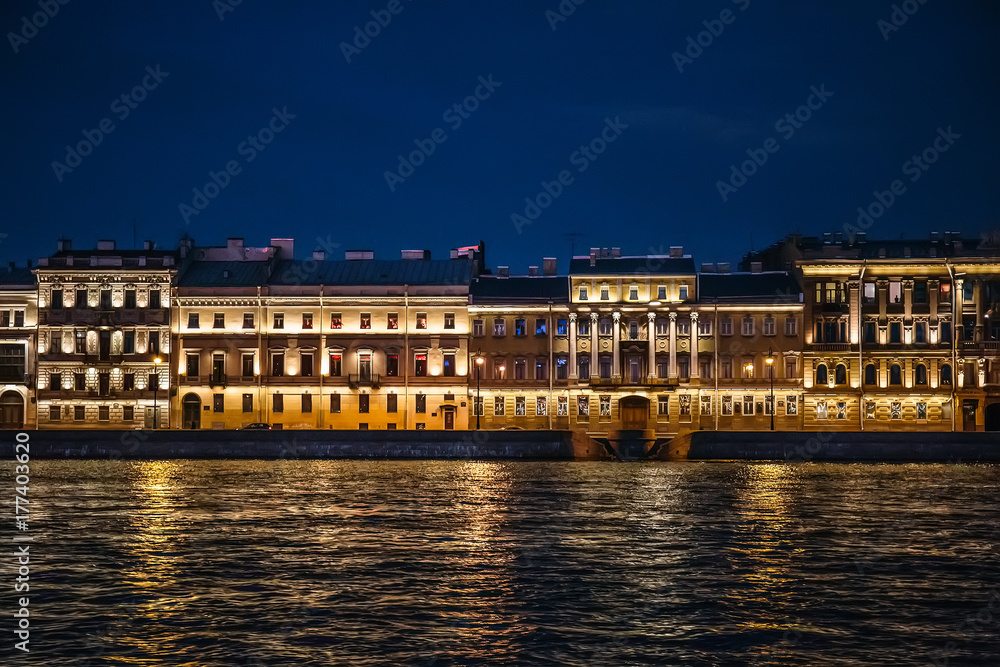 Night View of St. Petersburg from Neva River, buildings on embankment with