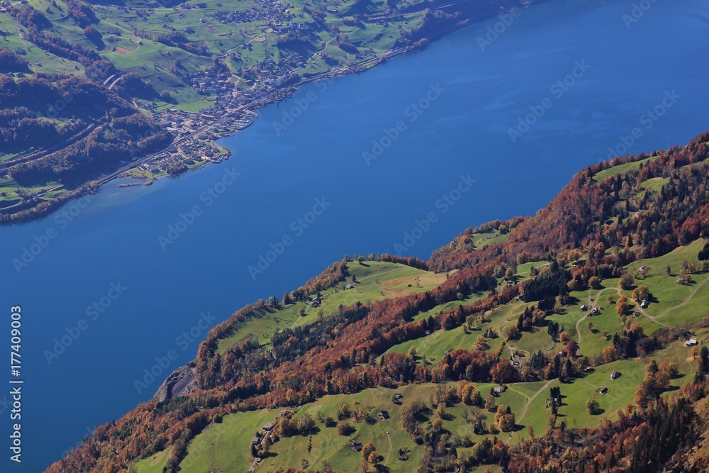 Lake Walensee and colorful forest. Walenstadtberg. View from Chaeserrugg. Autumn scene in Switzerland.