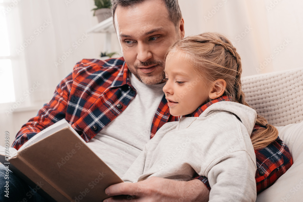 father and daughter reading book father and daughter reading book
