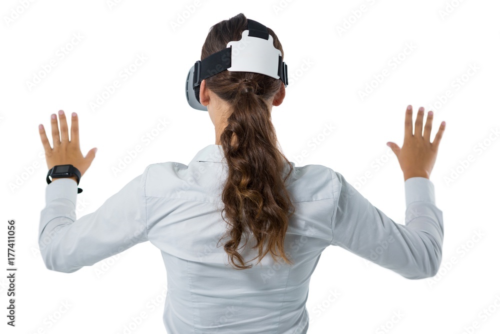 Female executive using virtual reality headset Female executive using virtual reality headset