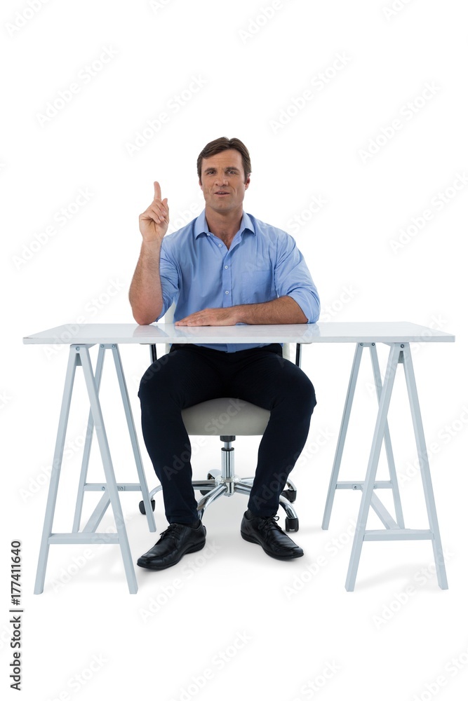 Male executive pressing an invisible virtual screen Male executive pressing an invisible virtual screen