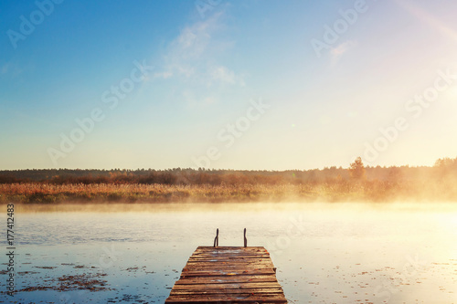 fog over the river, a bridge stretching out into the distance at dawn. Unity with nature.