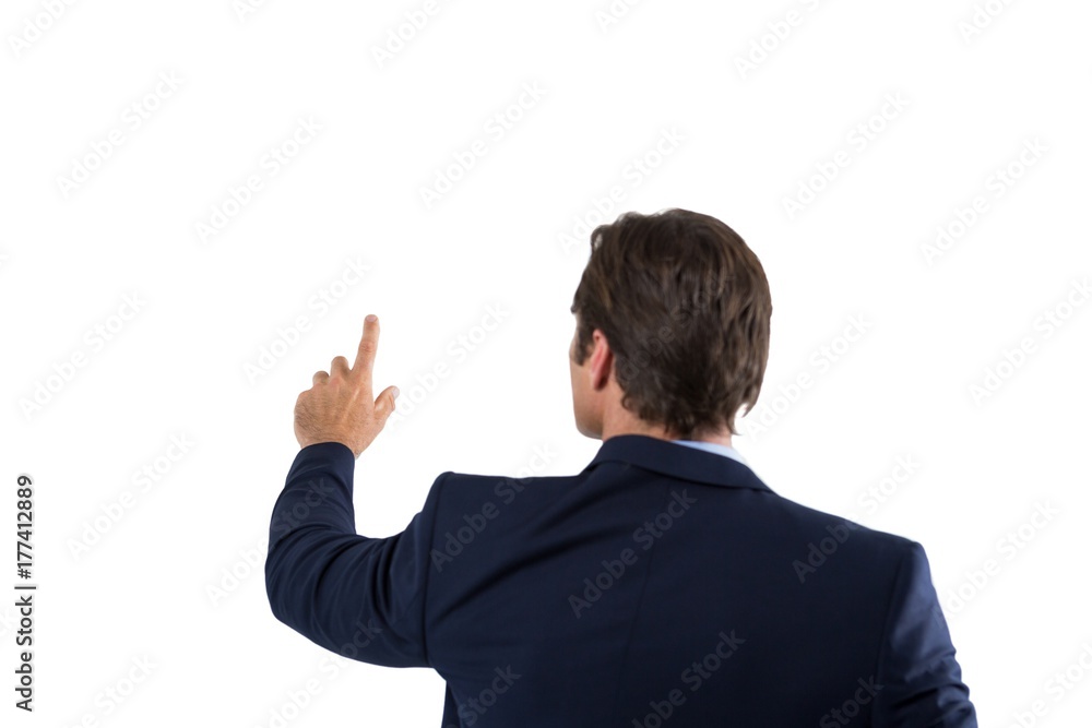 Businessman pressing an invisible virtual screen Businessman pressing an invisible virtual screen