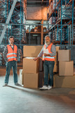 warehouse workers with digital tablet
