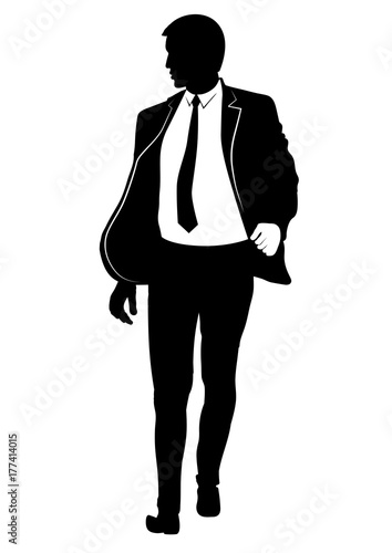 Silhouette of a walking man in a suit and tie
