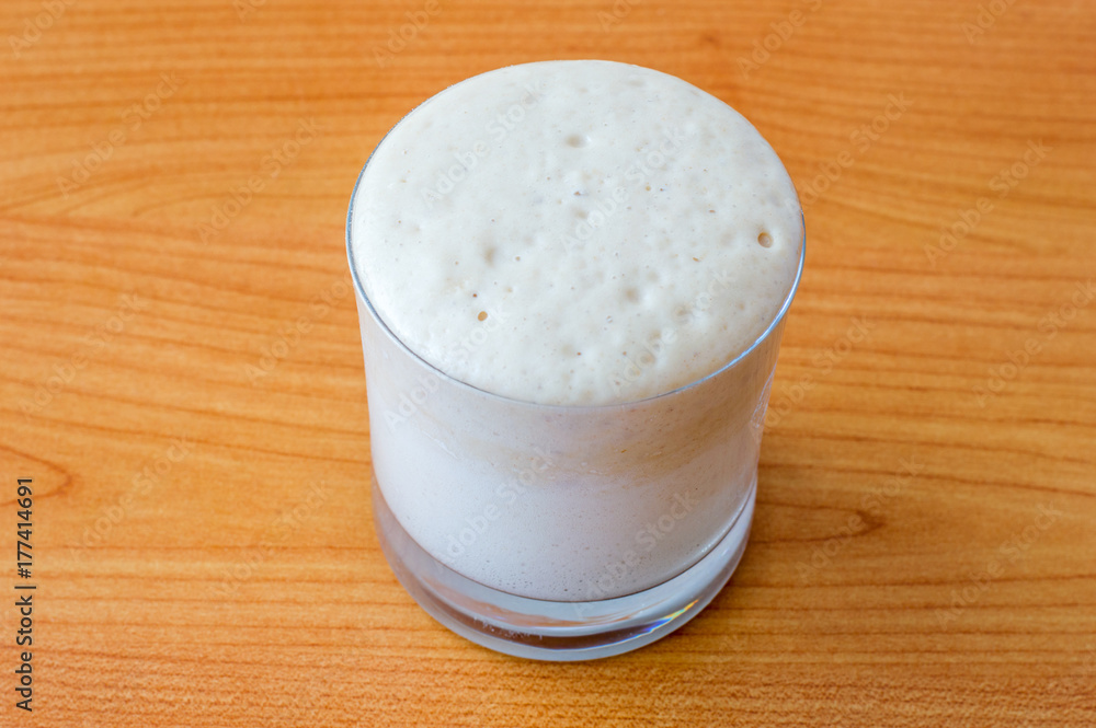 Yeast Sourdough Starter with sugar, flour and water in glass. Yeast Sourdough Starter with sugar, flour and water in glass.