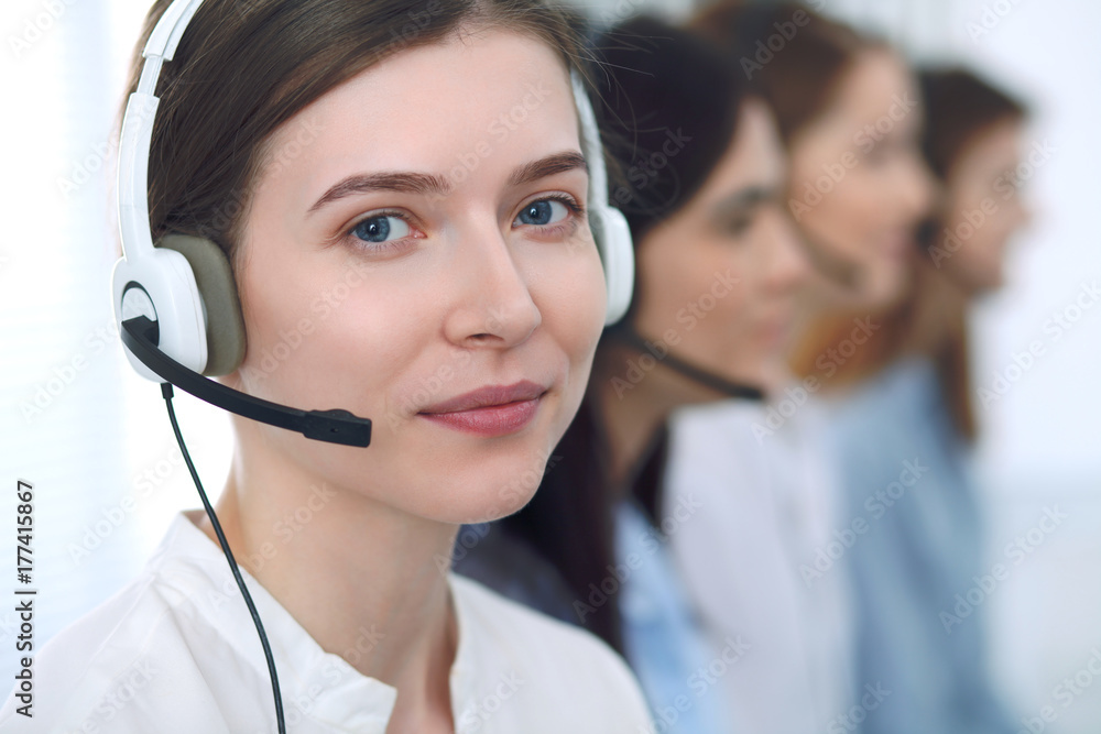 Call center operator.Young beautiful business woman in headset Call center operator.Young beautiful business woman in headset