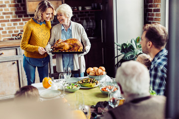 senior woman and her daughter with turkey