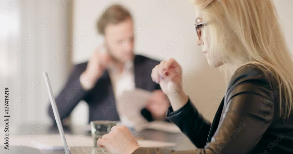 Extreme close up of business woman using tablet computer on a meeting Extreme close up of business woman using tablet computer on a meeting
