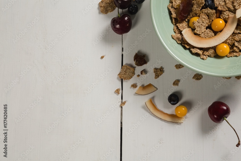 Bowl of wheat flakes with blueberry and golden berry Bowl of wheat flakes with blueberry and golden berry