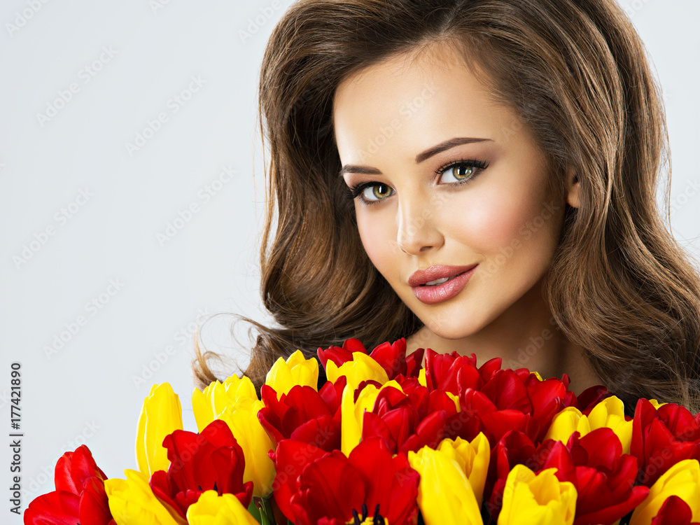 Beautiful young woman with flowers Beautiful young woman with flowers
