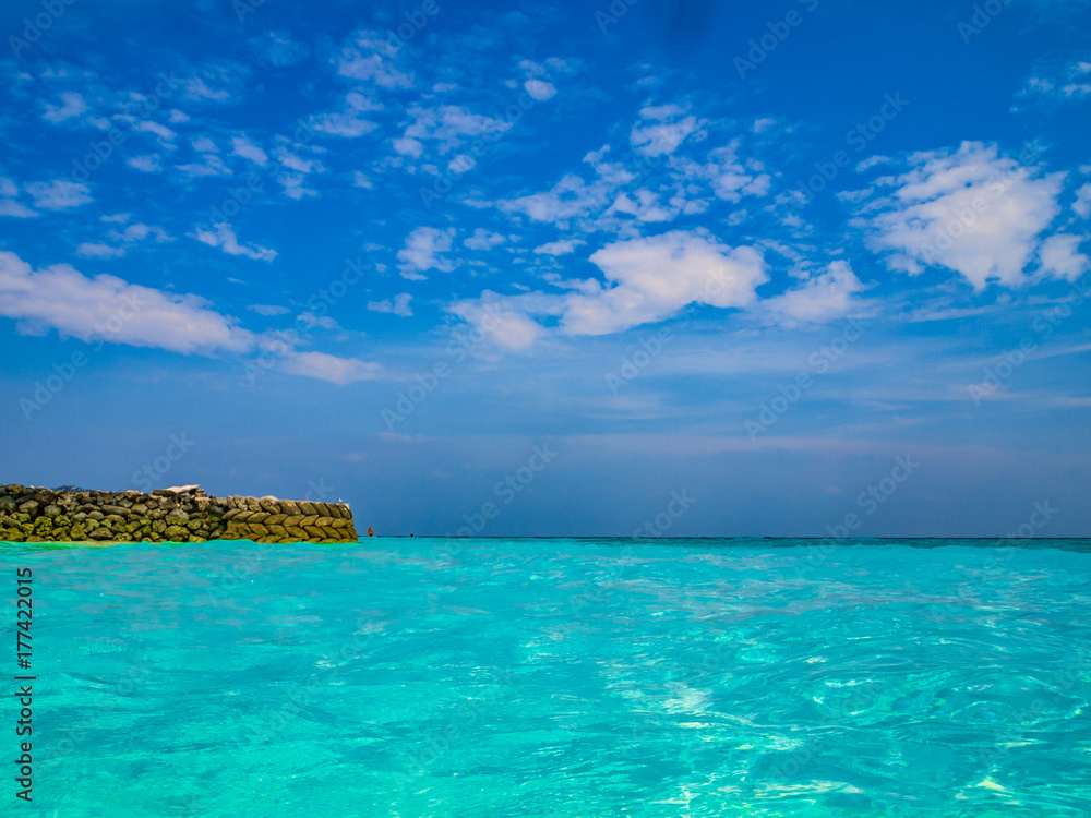 Tropical island vacation image, turquoise blue crystal clear water sea