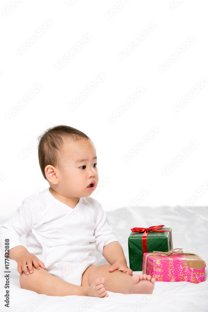 asian toddler and wrapped presents asian toddler and wrapped presents