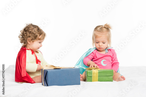 toddlers with wrapped gifts