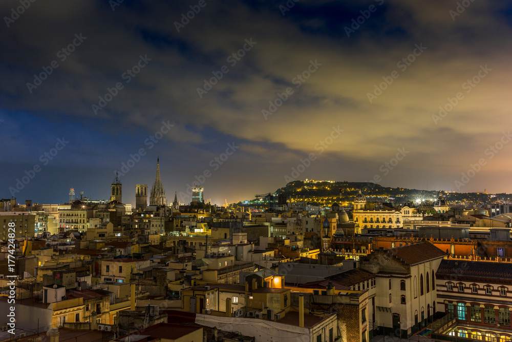 View of the roofs of Barcelona at night - 1