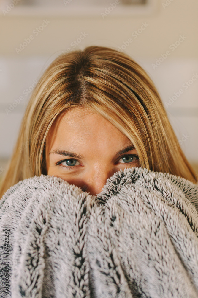 Cute Blonde Young Woman Covering Her Face with a Blanket Cute Blonde Young Woman Covering Her Face with a Blanket